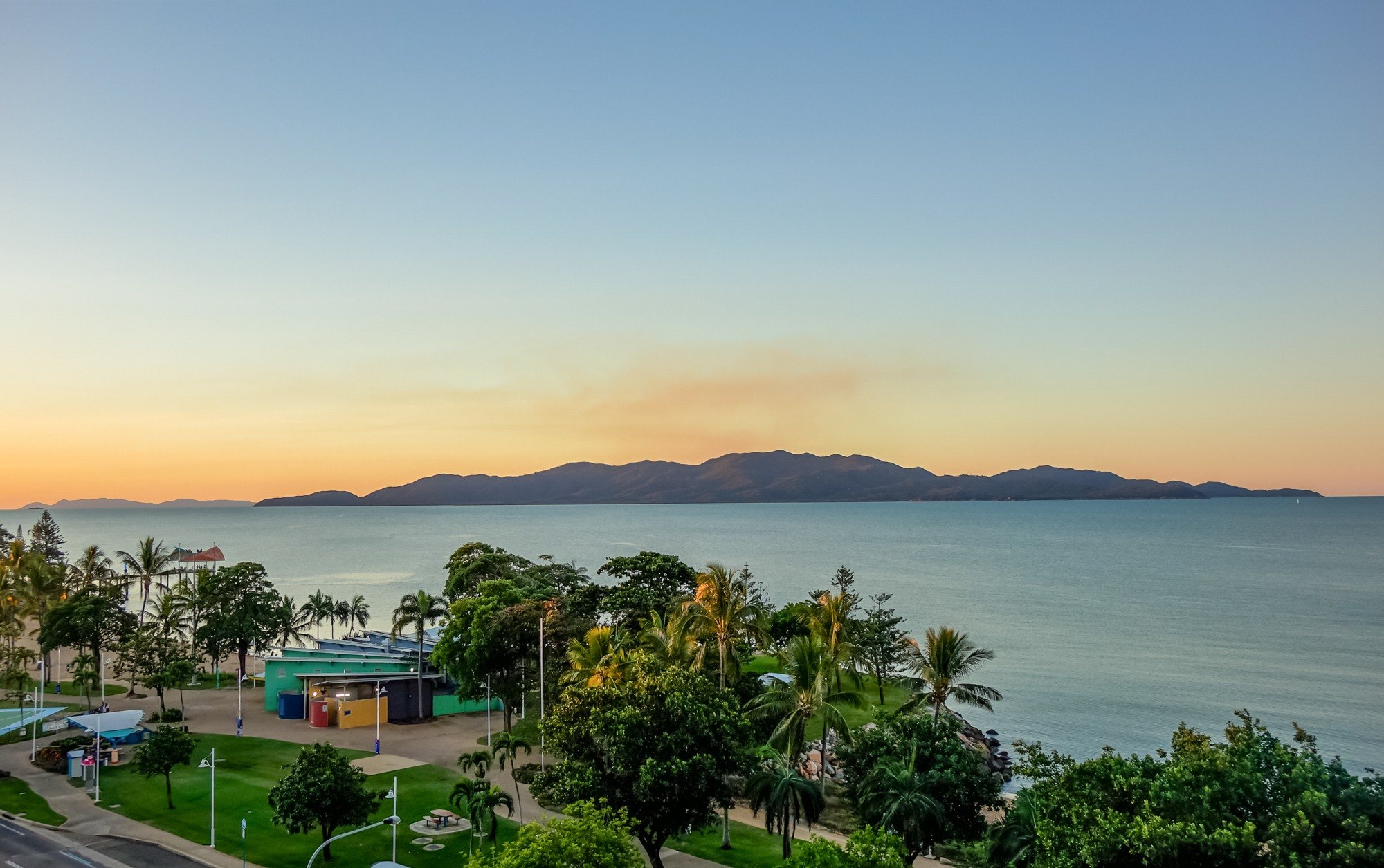 Magnetic Island across Cleveland Bay at sunset, above The Strand